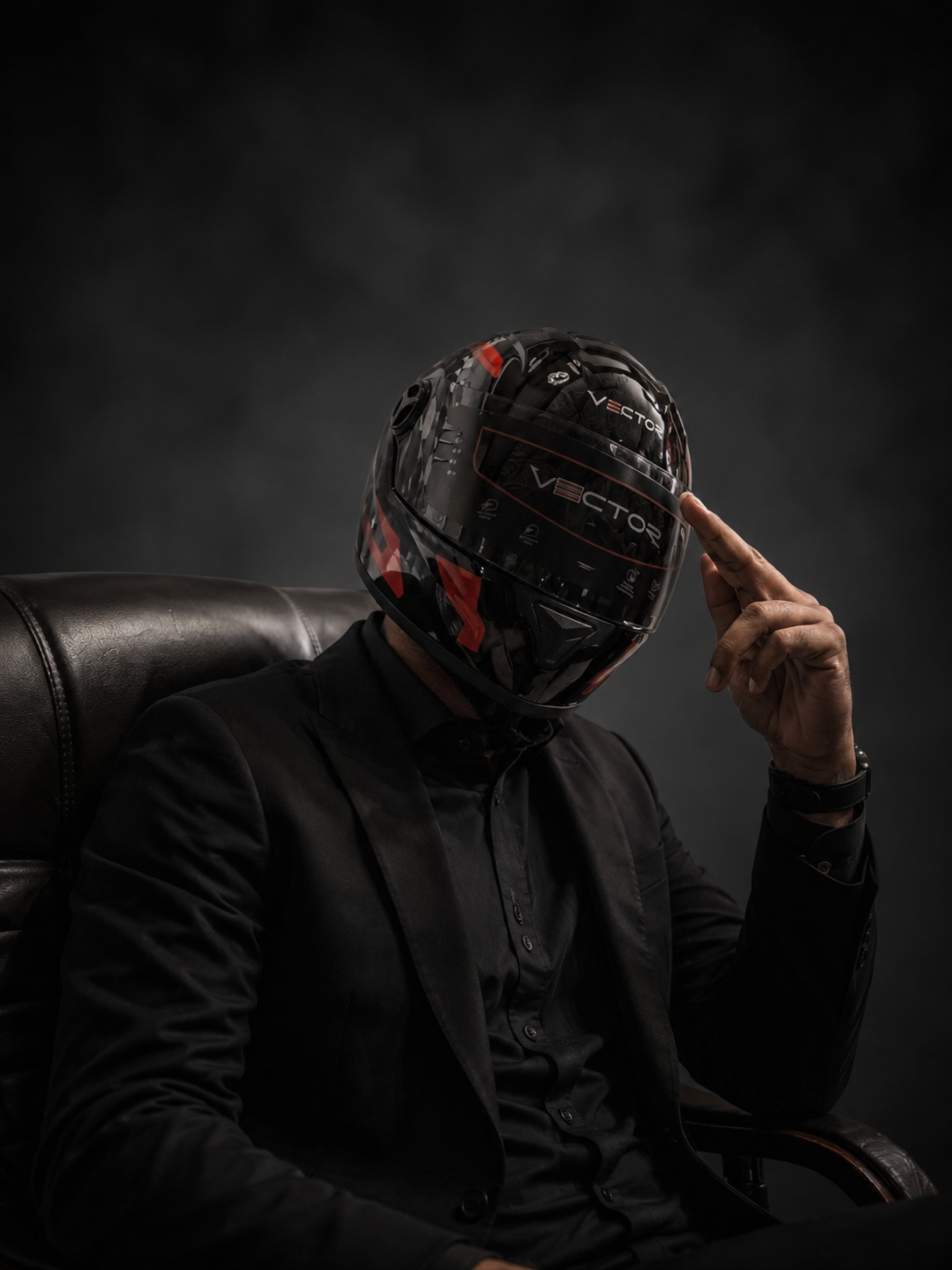 Rider wearing a black Vector full-face motorcycle helmet